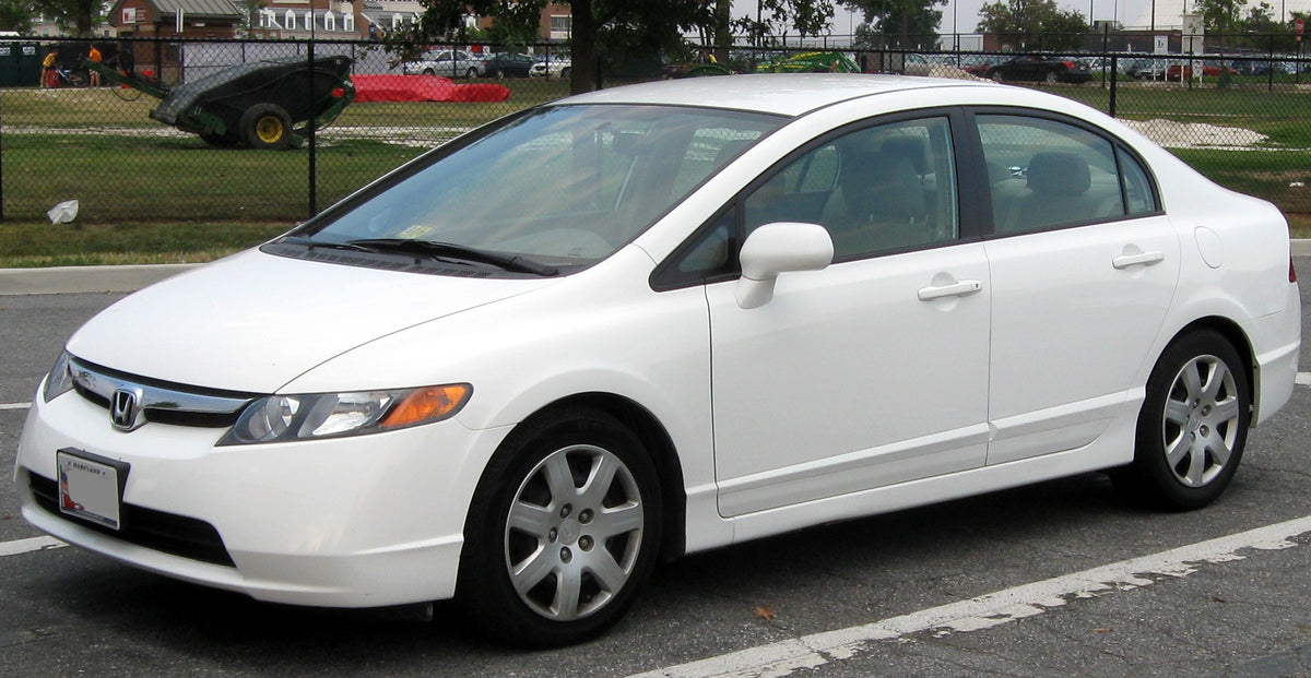Original photograph of a white Honda Civic LX sedan viewed from the front left